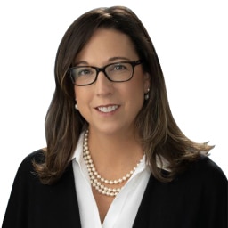 A headshot of associate Renee Files. She has long black hair and is wearing black eyeglasses.