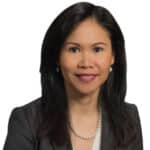 A headshot of associate Jasmine Yu. She has long black hair and is wearing a black blazer.