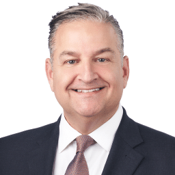 A headshot of associate Joel Morris. He has short dark hair and he is wearing a black suit.