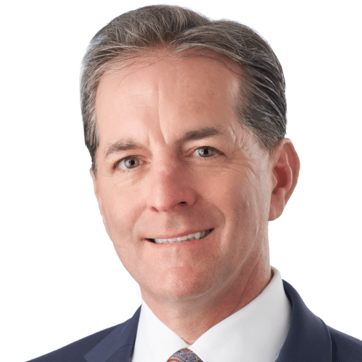 A headshot of associate Robert Schneider. He has short dark hair and he is wearing a navy blazer.