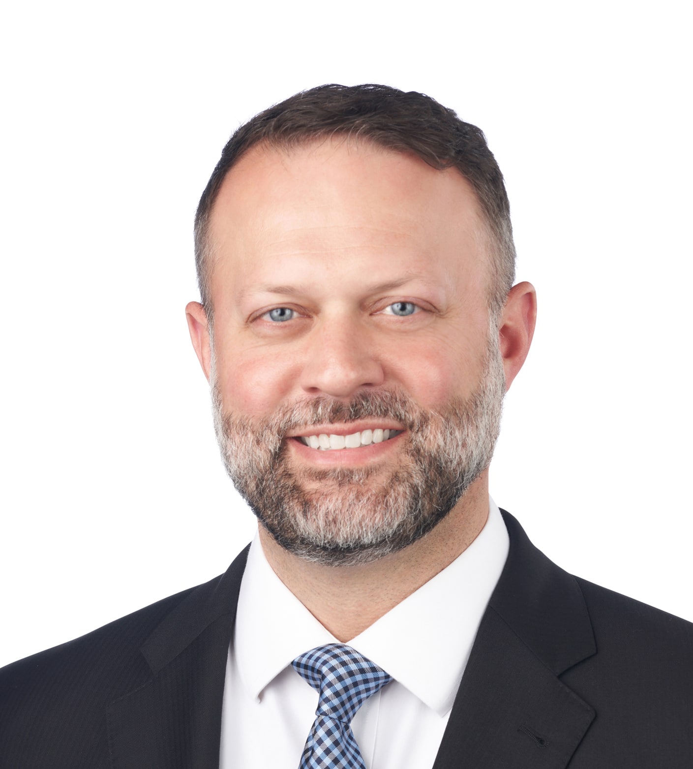 A headshot of associate Chris Ginder. He has short, dark hair, and is wearing a black suit.