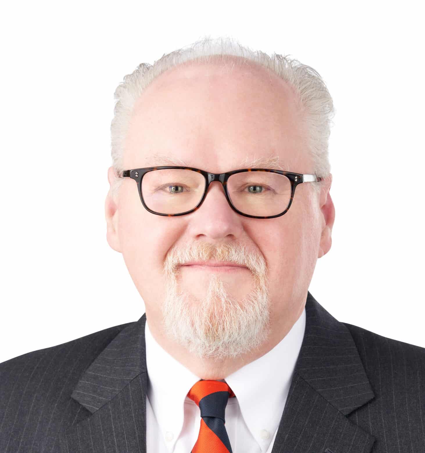 A headshot of associate David Holtzman. He is wearing tortoiseshell eyeglasses and a pinstriped suit.