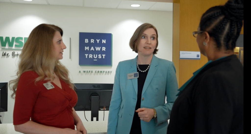 BMT Associates standing in a circle chatting about endowments