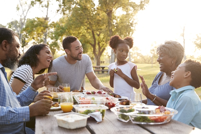 A family gathered around a picnic table.