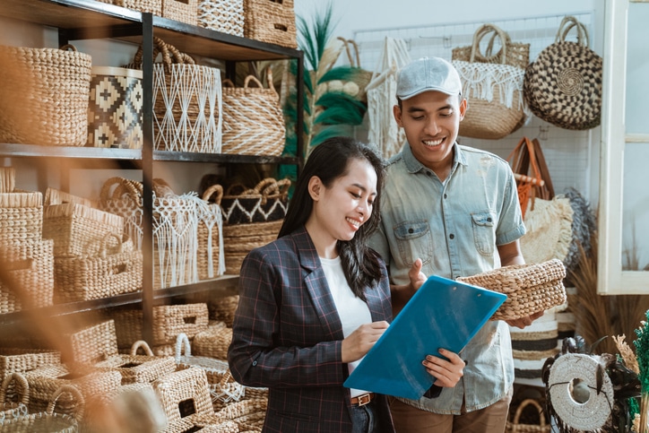 Two business owners in a basket shop.