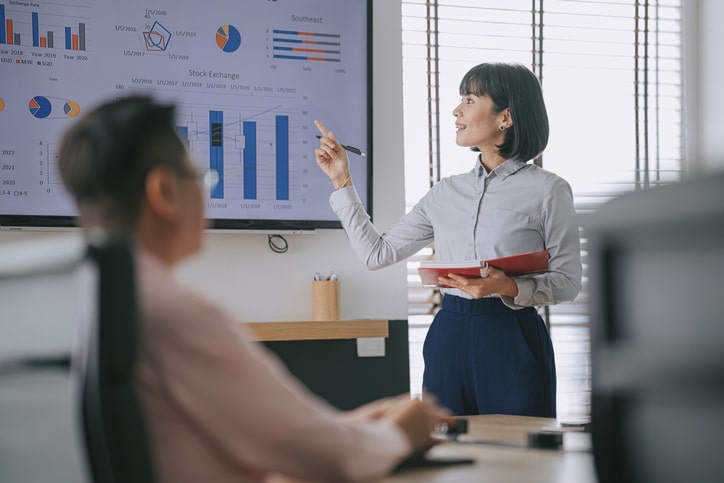 A woman giving a presentation.