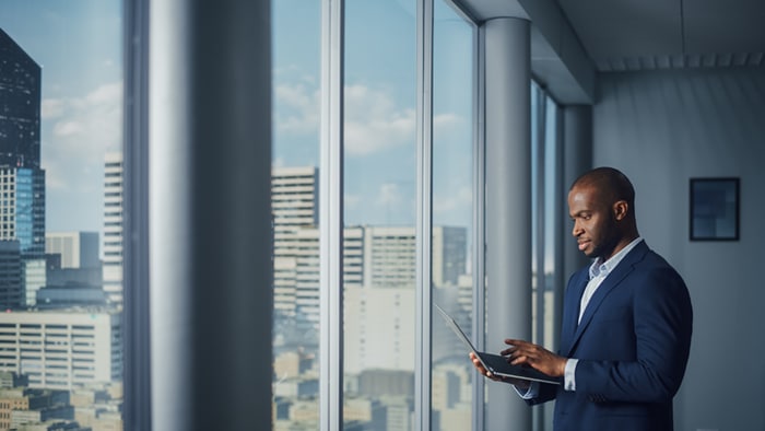 A businessman using a laptop.