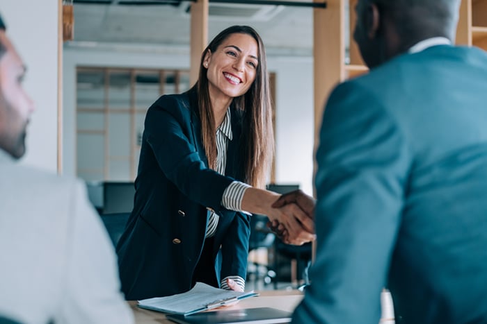 Businesspeople shaking hands.