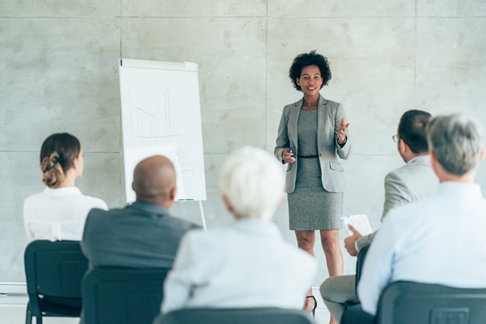 A woman giving a business presentation.