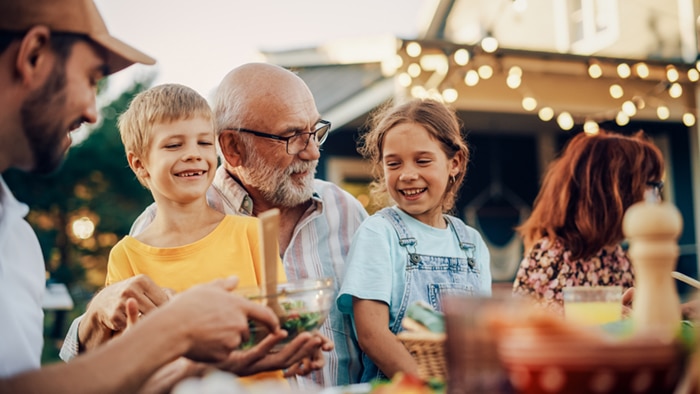 A grandfather with his grandchildren.