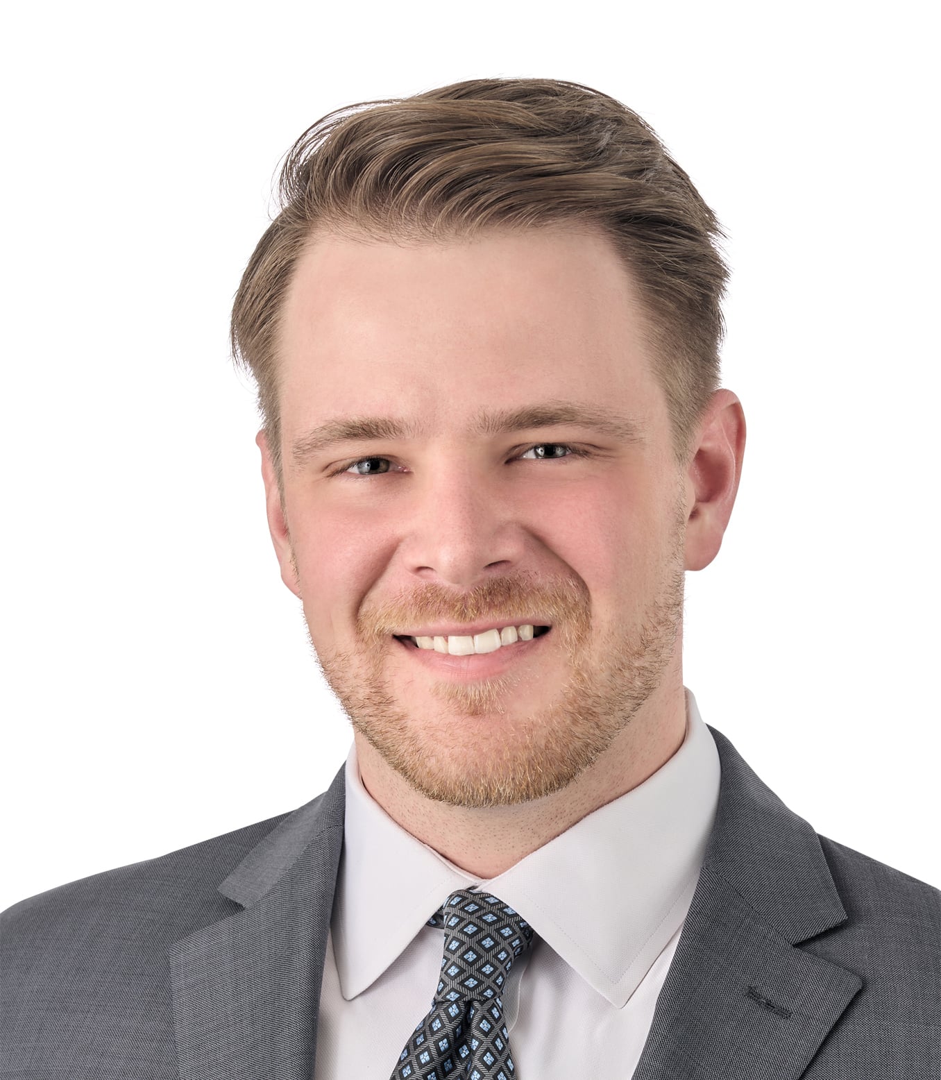 A headshot of associate Jeffrey Kitchen. He has short, brown hair, and is wearing a gray suit.