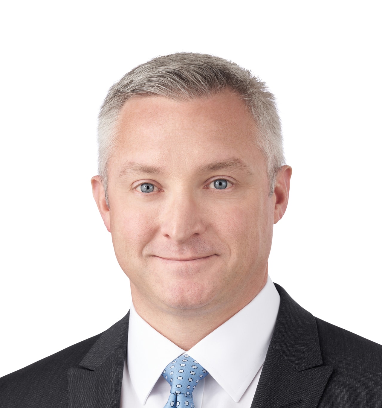 A headshot of associate Joseph Rodgers, CTFA. He has short gray hair and is wearing a black suit.