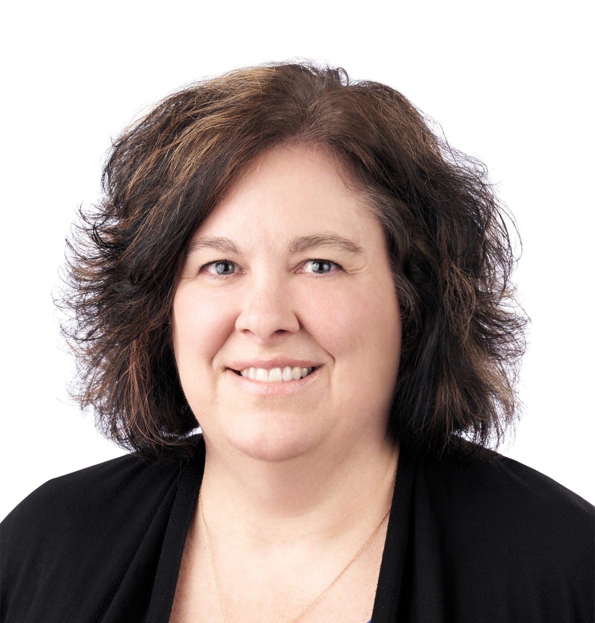 A headshot of associate Michelle McVey. She has dark, curly hair, and is wearing a black sweater.