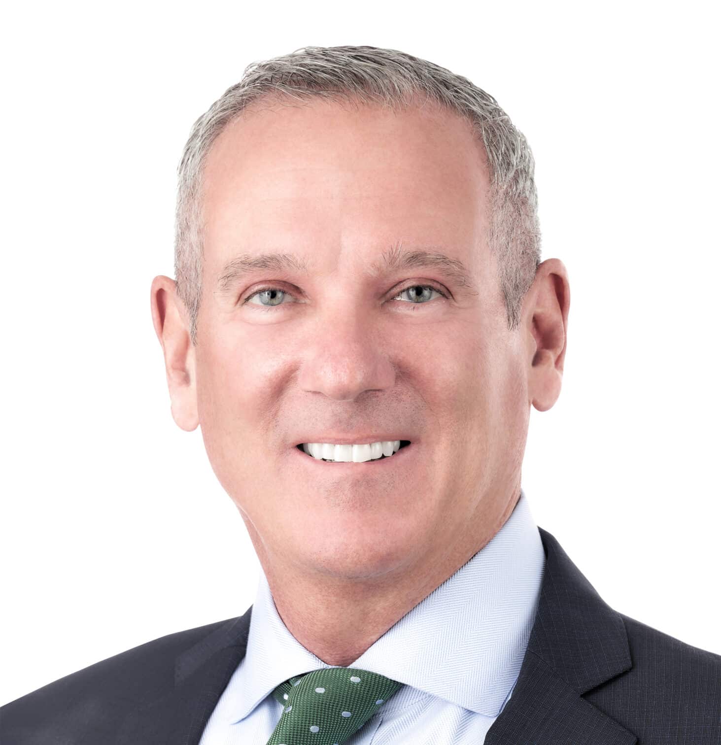 A headshot of associate Stephen Wellman. He is a smiling man with short gray hair.