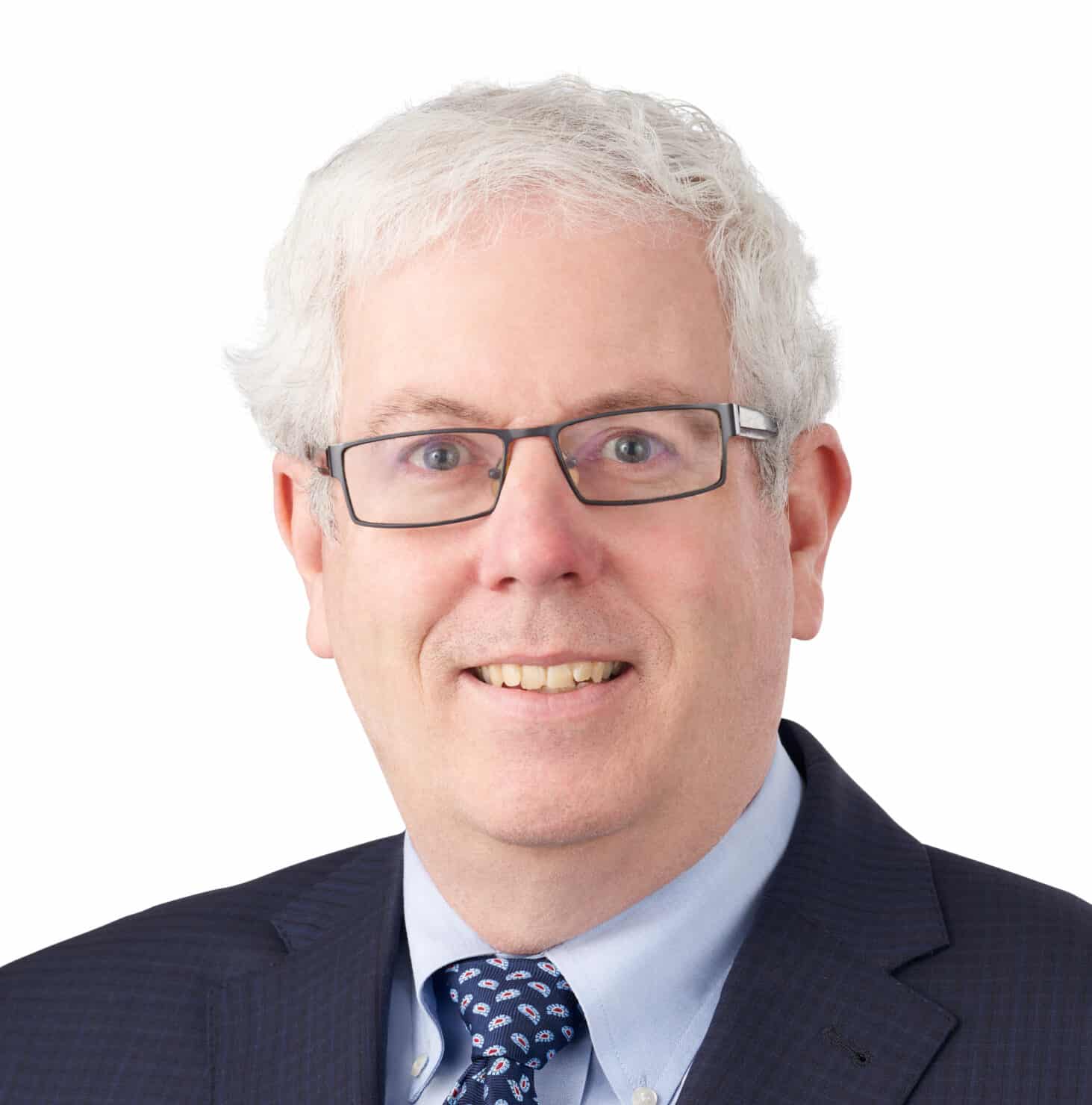 A headshot of associate Steven Klammer. He has short white hair and is wearing a black suit.